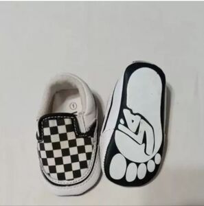 black and white youth vans slip on shoes